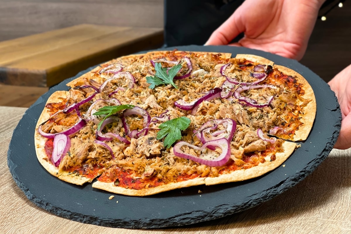 Delicious high protein tuna pizza served on a stone plate