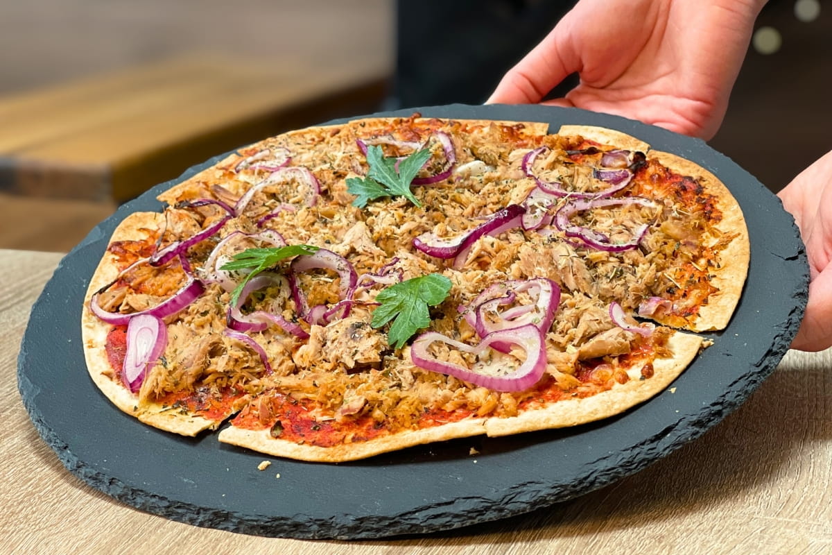 High-Protein Tuna Pizza served on a stone plate