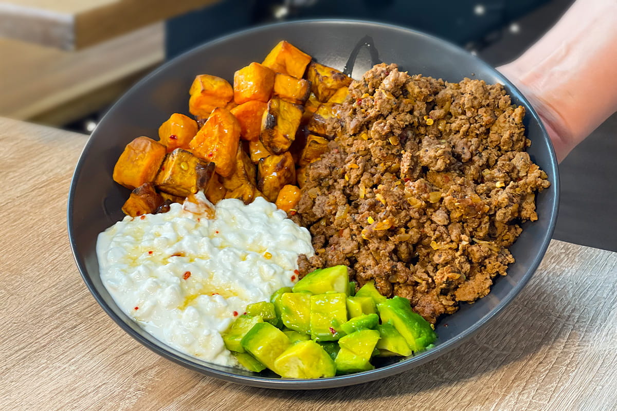Hot Honey Cottage Cheese Beef Bowl with avocado and crispy sweet potato cubes