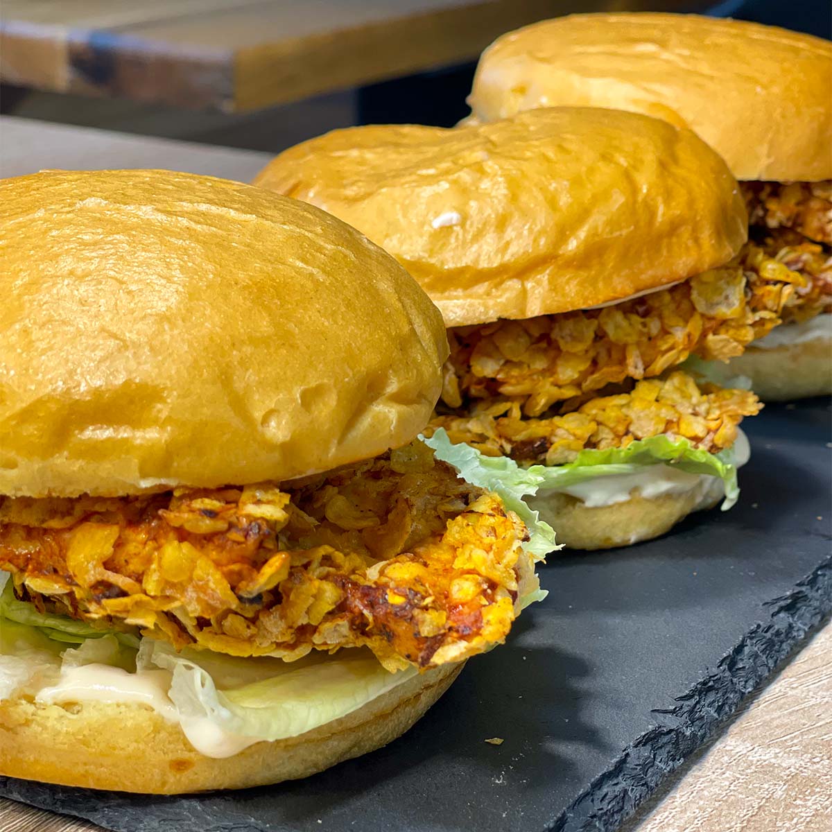 Close-up photo of High-Protein Chicken Sandwich (Copycat KFC Recipe) served on a stone plate