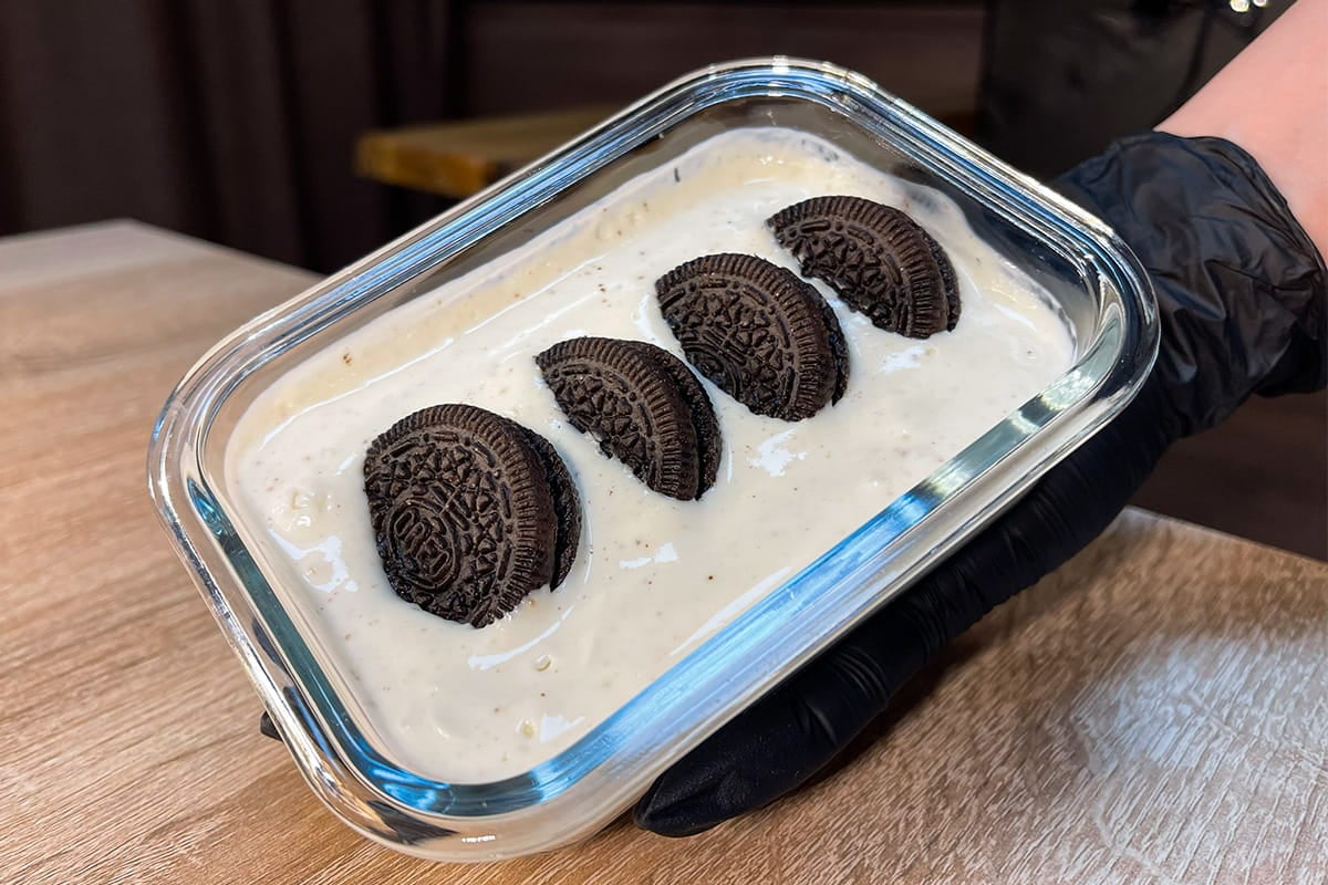 Macro-Friendly Japanese Yogurt Cheesecake with Oreos served in a glass container