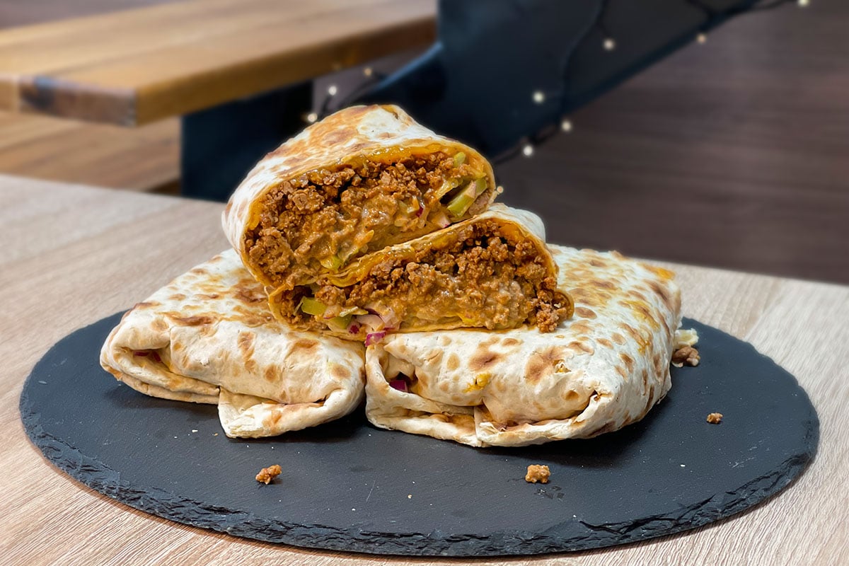 High-Protein Big Mac Wrap served on a stone plate