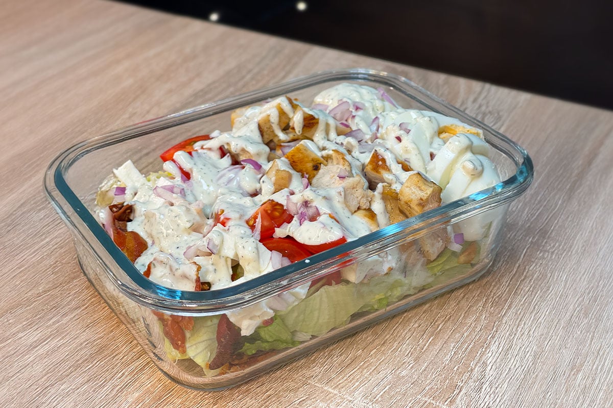 High-Protein Cobb Salad served in a meal prep container