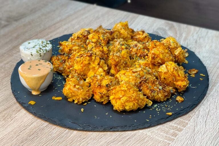 High-Protein Chicken Nuggets with Dipping Sauces served on a stone plate