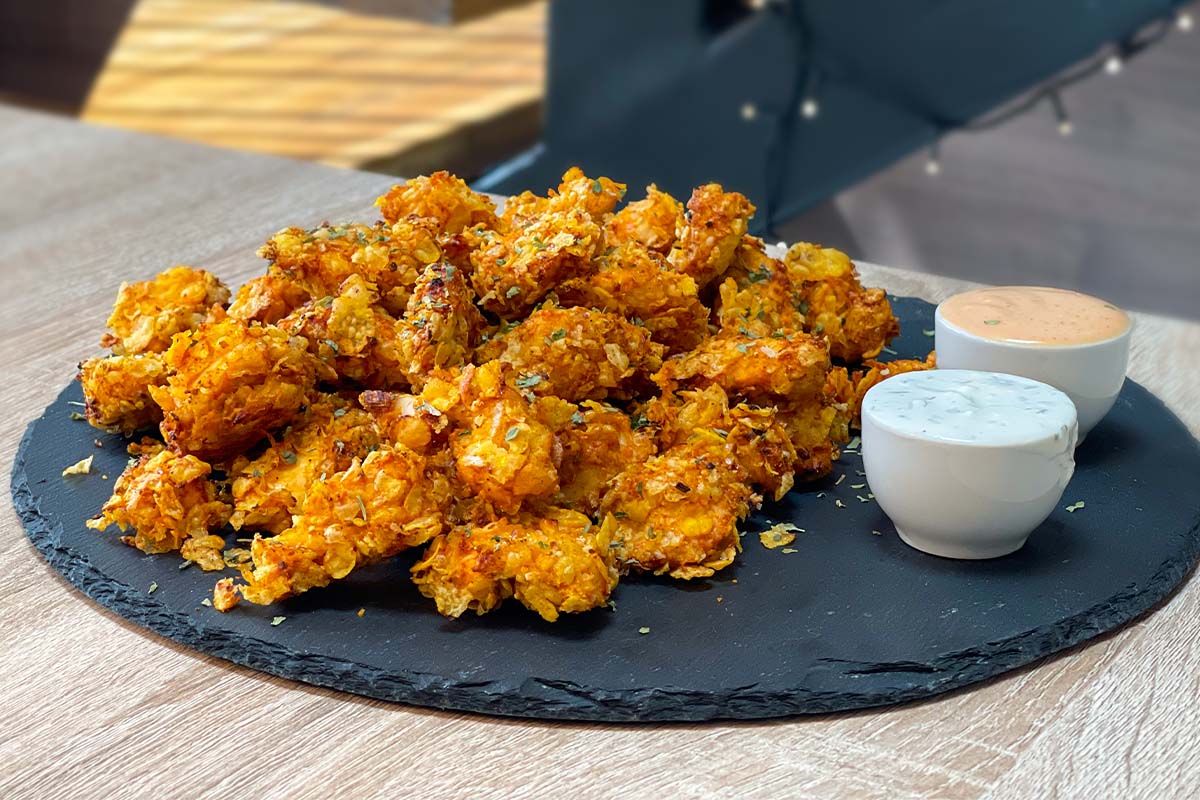 Air Fryer Popcorn Chicken with Dipping Sauces served on a stone plate